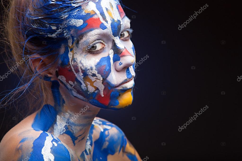 Face of a woman covered with paint Stock Photo by ©sandr2002 61650713